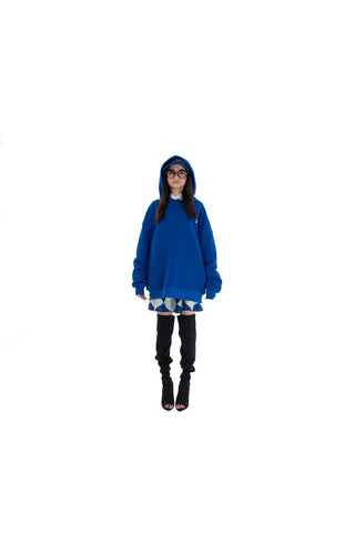Person wearing a blue hoodie on a white background