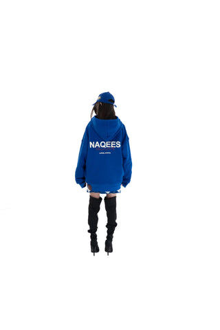 Person wearing a blue hoodie with 'NAQEES' branding on a white background