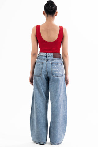 Light wash Nakam Howe wide leg jeans from the KKP collection by Naqees, worn — Pakistani streetwear