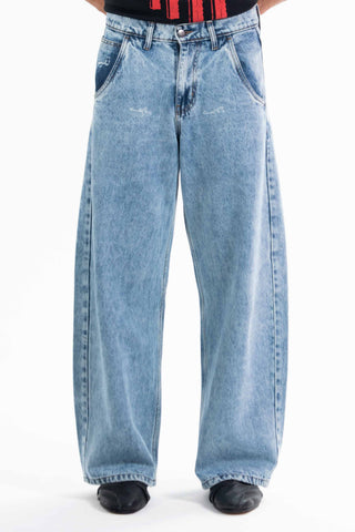 Light wash Nakam Howe wide leg jeans from the KKP collection by Naqees, worn — Pakistani streetwear