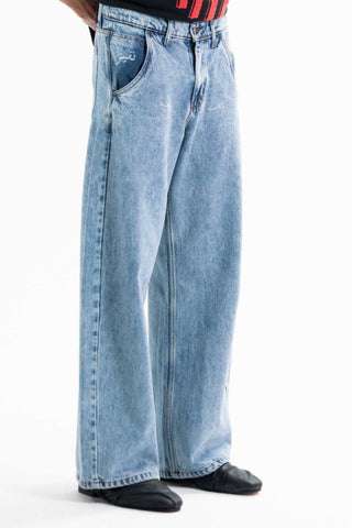 Light wash Nakam Howe wide leg jeans from the KKP collection by Naqees, worn — Pakistani streetwear