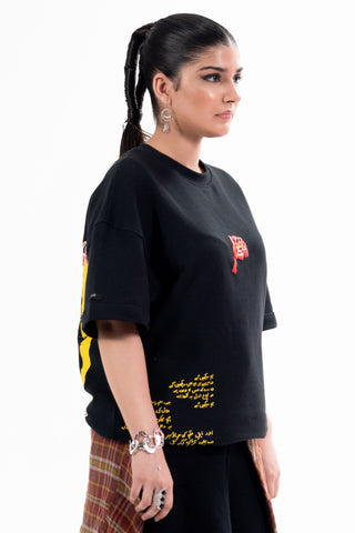 Black Wakeup Call tee from the KKP collection by Naqees, worn — Pakistani streetwear