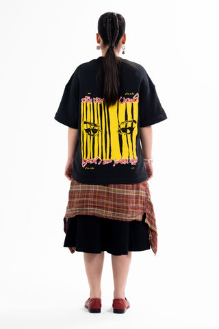 Black Wakeup Call tee from the KKP collection by Naqees, worn — Pakistani streetwear