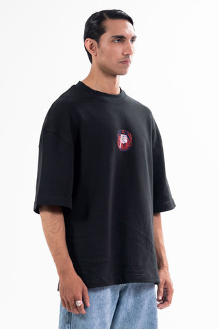 Black Sach Or Jhoot tee from the KKP collection by Naqees, worn — Pakistani streetwear