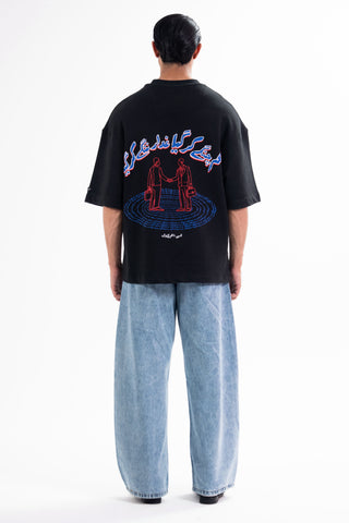 Black Sach Or Jhoot tee from the KKP collection by Naqees, worn — Pakistani streetwear