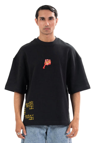 Black Wakeup Call tee from the KKP collection by Naqees, worn — Pakistani streetwear