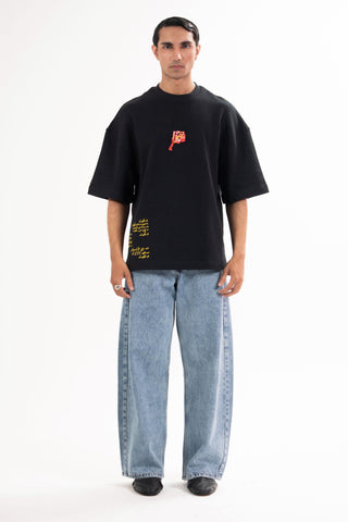 Black Wakeup Call tee from the KKP collection by Naqees, worn — Pakistani streetwear