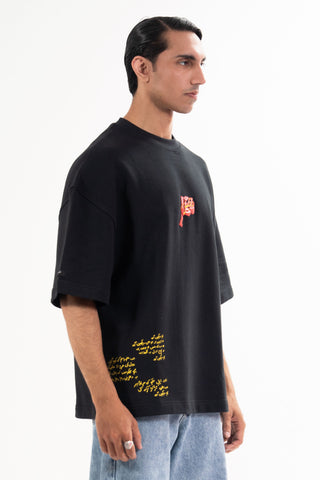 Black Wakeup Call tee from the KKP collection by Naqees, worn — Pakistani streetwear