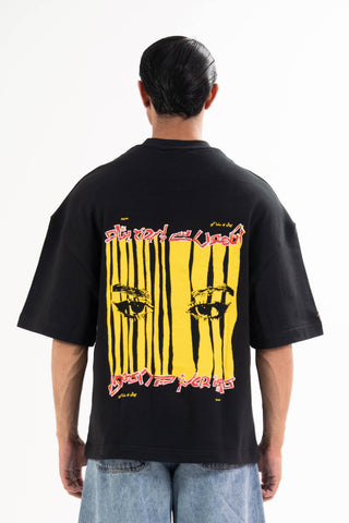 Black Wakeup Call tee from the KKP collection by Naqees, worn — Pakistani streetwear
