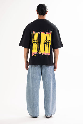 Black Wakeup Call tee from the KKP collection by Naqees, worn — Pakistani streetwear