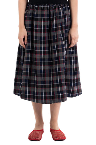 Navy and red check Maze midi skirt from the KKP collection by Naqees, worn — Pakistani streetwear