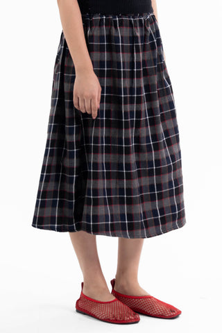 Navy and red check Maze midi skirt from the KKP collection by Naqees, worn — Pakistani streetwear