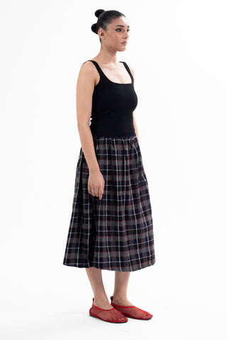Navy and red check Maze midi skirt from the KKP collection by Naqees, worn — Pakistani streetwear