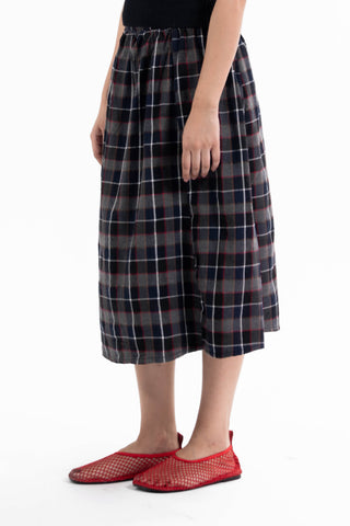 Navy and red check Maze midi skirt from the KKP collection by Naqees, worn — Pakistani streetwear