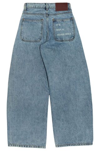 Light wash Nakam Howe wide leg jeans with Urdu pocket embroidery by Naqees, flat lay — Pakistani streetwear